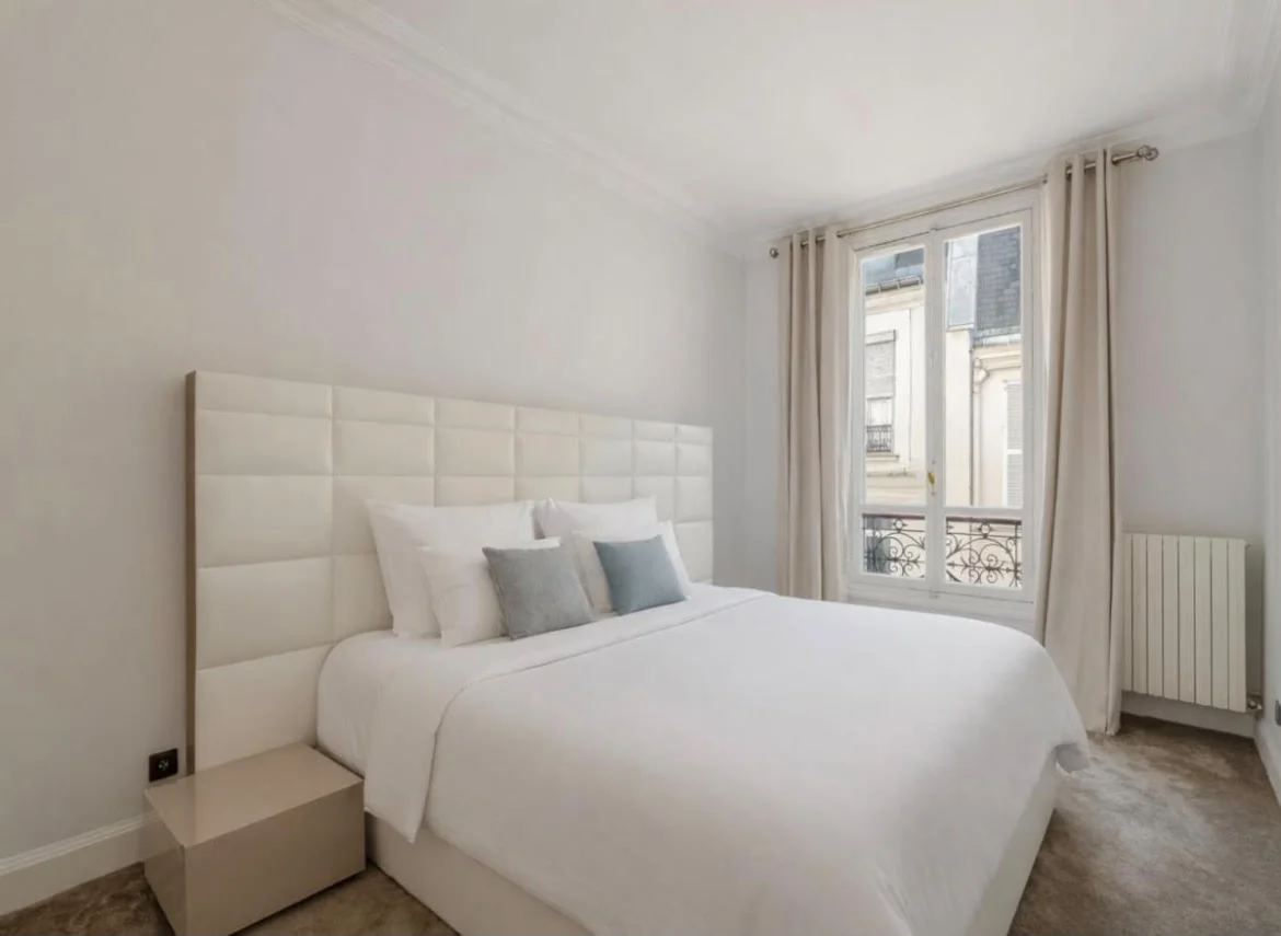 Bedroom with white headboard